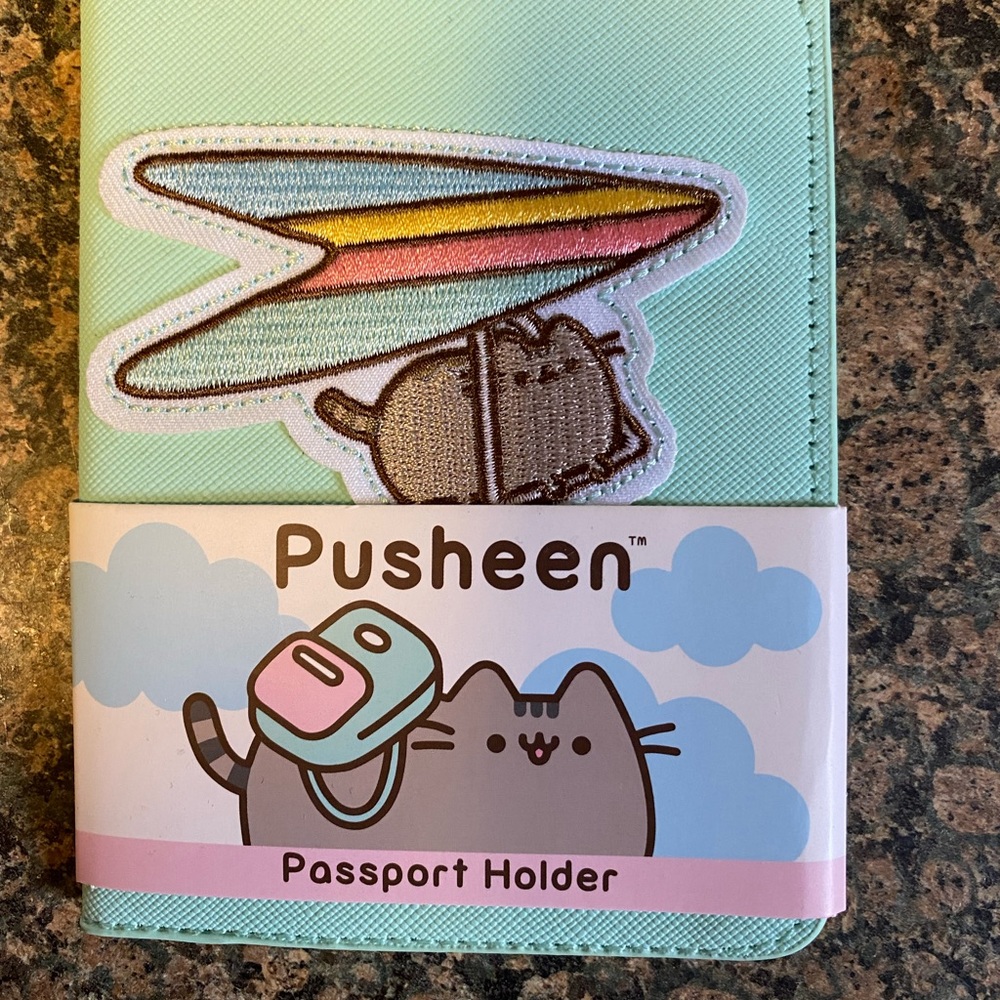 NWT- Pusheen passport holder. Stitched patch on holder. Brand new. Never used.